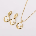 Detail of gold sun and moon necklace set with white shell inlay and sparkling crystals - Sun and Moon Jewelry Set (AML03835) / Gold