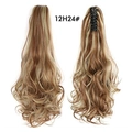 Macro detail of brown blonde wavy ponytail extension with claw clip attachment - Golden Blonde Highlights