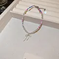 Detail of beaded bracelet featuring a silver bow charm and adjustable heart extension chain - 37# Bracelet-Silver-Pink