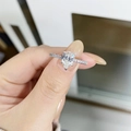 Classic S925 silver wedding ring with 1ct pear-cut moissanite stone on female hand - US 5 / Pear Halo Ring-Silver
