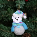 Weihnachtsbaumschmuck in Form eines blauen Bären mit Plüschkopf und leuchtender Kugel - Bär