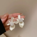 Detailed macro view of floral stud earrings with pearlescent petals and pearl center inlay - White Flower Stud Earrings (11#)