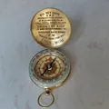 Close-up of vintage brass compass with engraved sentimental message for son - From Mom to Son