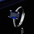 Silver ring featuring a large rectangular blue gemstone and side cubic zirconia accents - White Gold [sapphire Blue Diamond] Ljz-259 / Adjustable Open