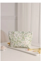 Floral makeup bag with white flower pattern on marble tray with makeup brushes - Green Leaf Floral