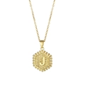 Gold hexagon letter J pendant necklace with textured finish and beaded edge detail - Letter J
