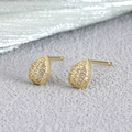 Elegant gold drop earrings with micro-pave cubic zirconia on a gray textured background - Water Drop