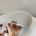 Close-up of beige knit newsboy cap showing breathable hollow texture and leather logo - M(56-58cm) / Beige
