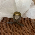 Minimalist translucent olive green hair claw clip with golden spring on woven tray - Bright Olive Green