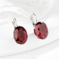 Elegant silver leverback earrings featuring oval red gemstone in a minimalist setting - Red