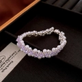 Vue détaillée du bracelet plaqué or avec étoiles en cristal violet et perles blanches - Style Tressé Étoile Violette (19#)