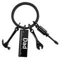 Close-up of black matte tool keychain with Dad ruler, hammer, screwdriver and wrench - Dad - Tool Keychain / Black