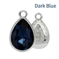 Teardrop-shaped inky blue faceted gemstone pendant with silver floral engraved back - Ink Blue