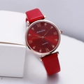 Detail of red sunray dial with Roman numerals and rhinestones on a rose gold watch - Red
