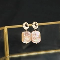 Elegant gold baroque pearl drop earrings featuring pink rectangular pearls on a black stand - Irregular Groove Stud Purple Square Baroque