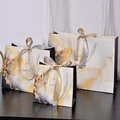 Three marble pattern gift bags with gold silk ribbons and Happy Times slogan in various sizes - White Gold Marble (Gold Silver Ribbon) / Small 18*16*10cm