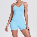 Close-up of seamless ribbed knit sky blue yoga set featuring V-neck sports bra and shorts - Light Blue