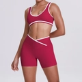 Detail of high-waisted yoga shorts with unique V-shaped white cross waistband design - Carmine