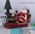 Resin Santa Claus driving a steam train ornament with mini Christmas tree and gifts - Steam Train Santa Type A