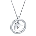 Detailed macro view of heart charm necklace with engraved letter F in silver finish - Letter F
