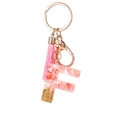 Pink letter F resin keychain with gold leaf flakes, pink tassel, and gold-tone hook charm - Pink Gold Foil F