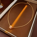 Gold-plated waist-shaped necklace with red and white zircons in a brown jewelry box - Gold-Pink