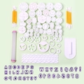Flat lay of a complete fondant baking set with assorted cutters and carving tools - 108pcs Set Zh290