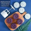 Macro detail of a 100g round mooncake mold set with 4 stamps and a handheld press tool - Round Set 6 (4 Patterns)