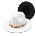 Detailed view of bicolor fedora hat featuring a bold gold acrylic chain decoration - White + Black