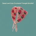 Detailed view of pink crochet bandana featuring red strawberry embroidery and ties - Strawberry Red