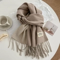 Double-sided camel and beige cashmere scarf with long tassels on a white table - 200cm / Khaki Beige