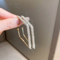 Minimalist gold hoop earring with sparkling white zircons held in hand close-up - Gold Rhombus (S925 Silver Pin)
