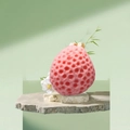 Soft pink honeycomb bath sponge with oval shape and fine pores on elegant stone stand - Pink