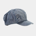 Detail of vintage washed blue denim newsboy cap with textured stitching and short brim - Light Blue