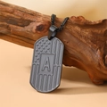 Black military dog tag necklace featuring a US flag pattern and the letter A on wood - Letter A Necklace