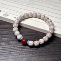 Star Moon Bodhi prayer beads with red agate and turquoise on dark wood background - Star Moon Bracelet (Agate Style)