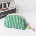 Mini green woven coin purse with colorful stripes, beige zipper, and beaded drawstring - Small Shell / Green