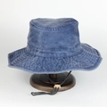 Macro shot of blue washed canvas fishing hat with metal eyelets and adjustable chin strap - Adjustable / Blue