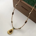 Tiger eye beaded necklace with a gold water drop pendant featuring an oval gemstone inlay - Tiger Eye Crystal Necklace XL0351