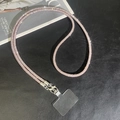 Detailed view of luxury pink rhinestone phone wristlet strap with silver metal lobster clasp - Pink