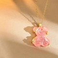 Detail of pink resin bear pendant with gold stars and micro-inlaid zircon on gold chain - Pink Cross Chain