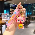 Adorable pink dragon baby keychain holding a small orange fruit charm for backpacks and bags - Large / B392-3 Orange