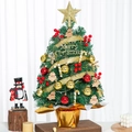 Detailed view of decorated mini Christmas tree with gold ornaments and red berries - SYT308