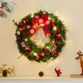 Christmas wreath with LED lights, red bows and candy ornaments on white wall - Style B Wreath With LED Lights