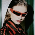 Y2K fashion red oversized wrap sunglasses on a model with golden drop earrings - Red Frame Grey Lens