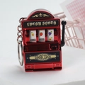 Detailed close-up of a red mini lucky slot machine keychain with a metallic finish - Electroplated Red