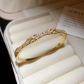 Macro detail of gold-plated quilted bangle with sparkling cubic zirconia pavé setting - Quilted Full Diamond Style (8#)