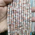 Detailed view of multi-strand natural stone beads in cylindrical shape for DIY jewelry - Red Network Stone