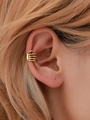 Gothic punk gold skull hand ear cuff earring worn by model for Halloween accessory look - Skull Hand Ear Bone Clip (11584) / Antique Gold