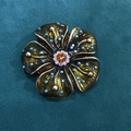 Vintage flower brooch with blue and orange crystals on a dark green velvet background - Dark Green Hibiscus Style